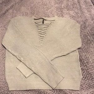Light sage green sweater with front cut out